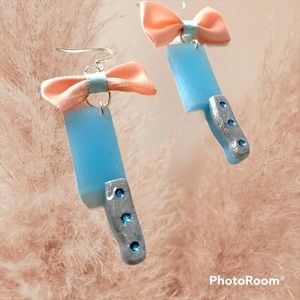 Kawaii style blue and silver sparkle cleaver, axe dangle earrings with pink bow